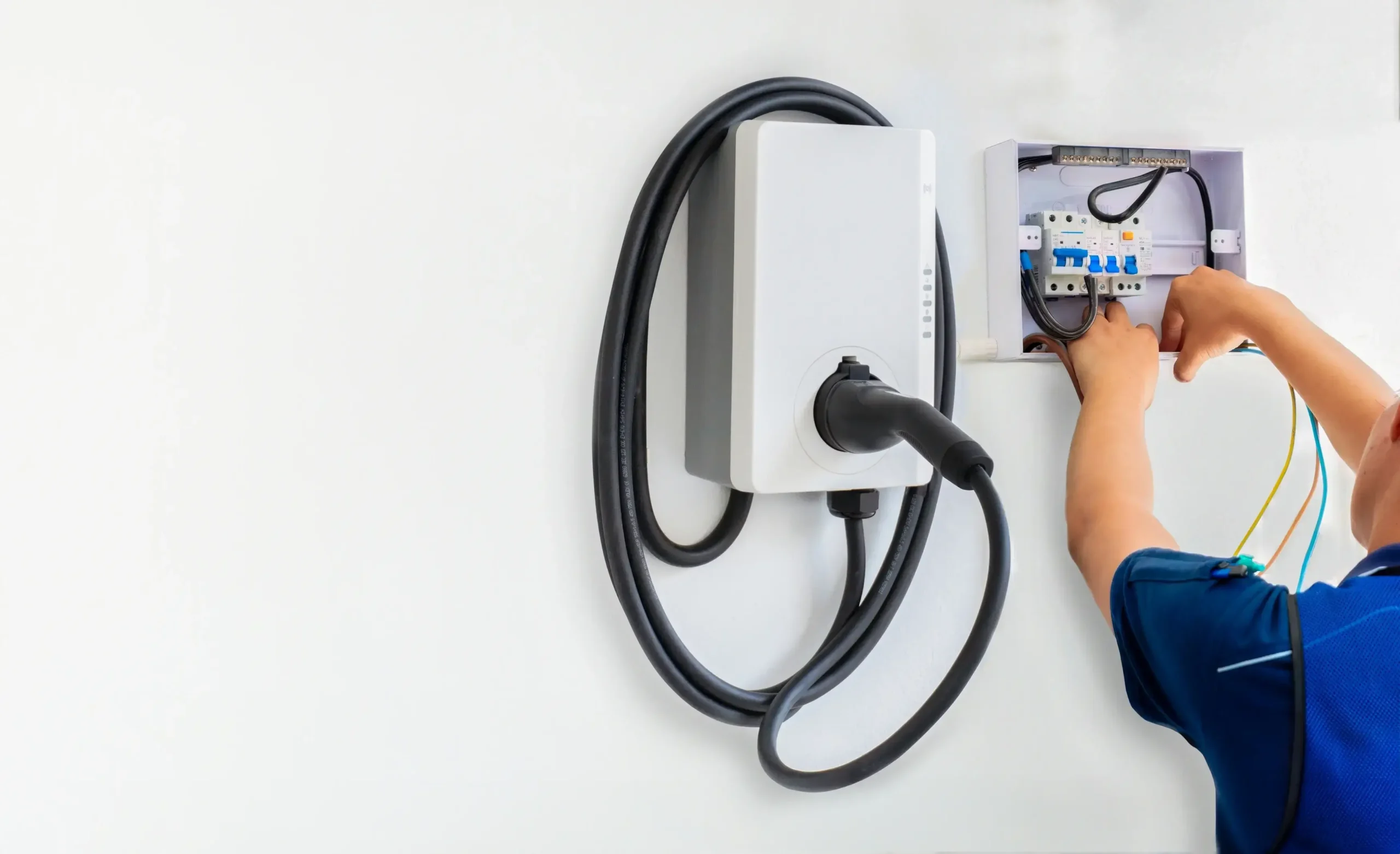 certified-male-electrician-installing-home-ev-charger