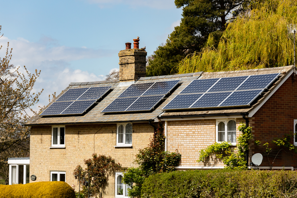 countryside house that has had solar panels installed on the roof